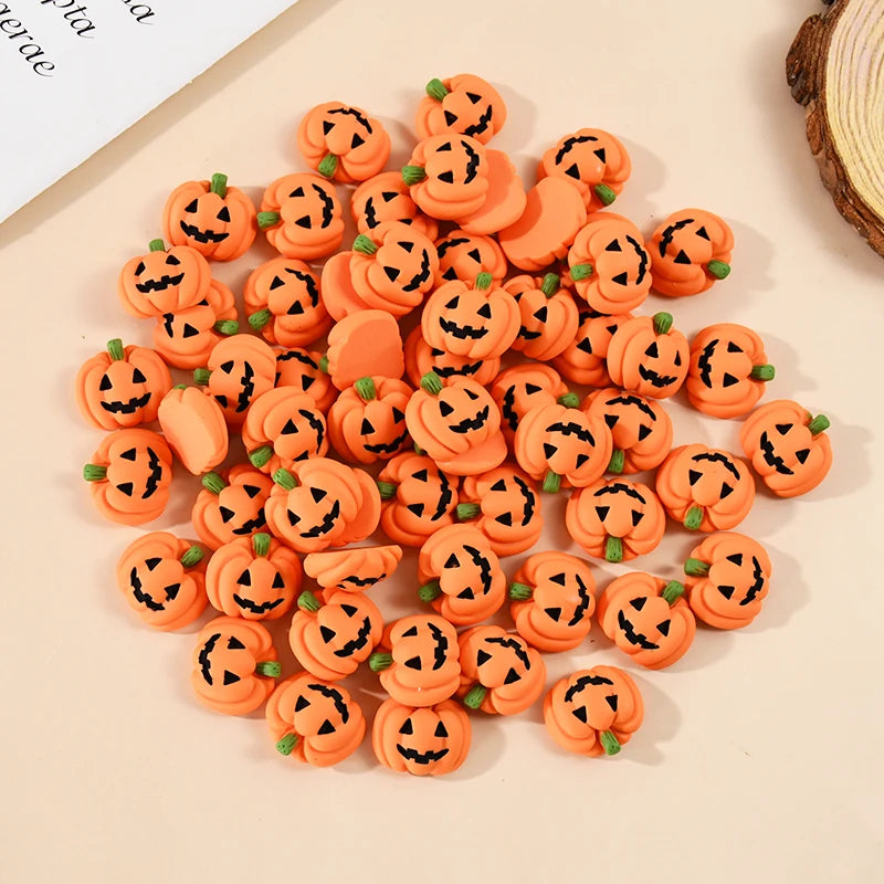 A collection of 20 orange resin pumpkin charms for fall decor arranged on a light background.