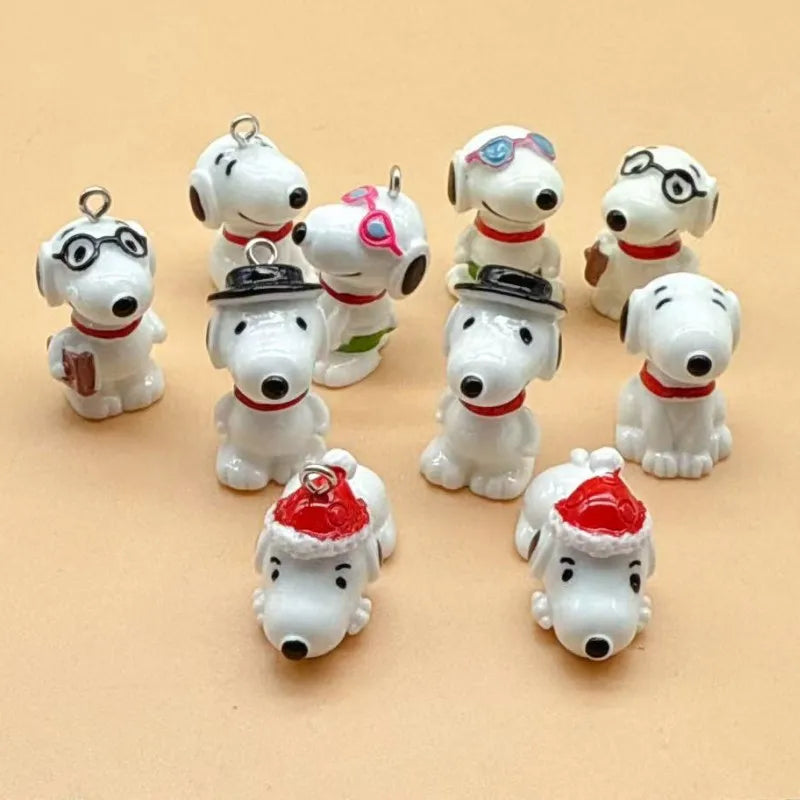 A collection of white ceramic dog pendants in various styles and colors for jewelry making.