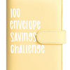 A light yellow binder cover titled 100 Envelope Savings Challenge.