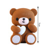 A cute brown teddy bear shaped cake topper with white accents and pink ball decorations.