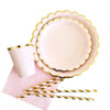 Gold and pink disposable party tableware set including cups, napkins, and straws