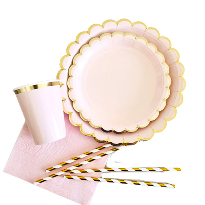 Gold and pink disposable party tableware set including cups, napkins, and straws
