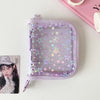 A lavender glitter star card binder for collectibles featuring small animal illustrations.