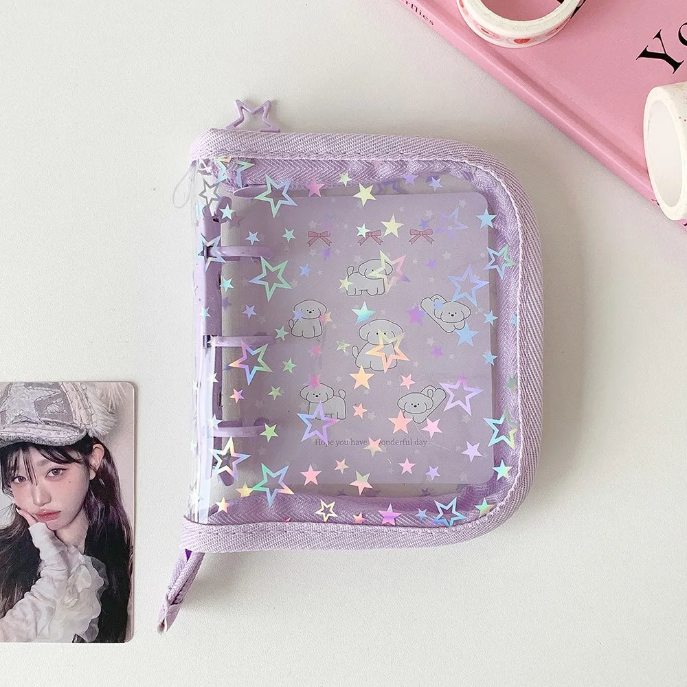 A lavender glitter star card binder for collectibles featuring small animal illustrations.