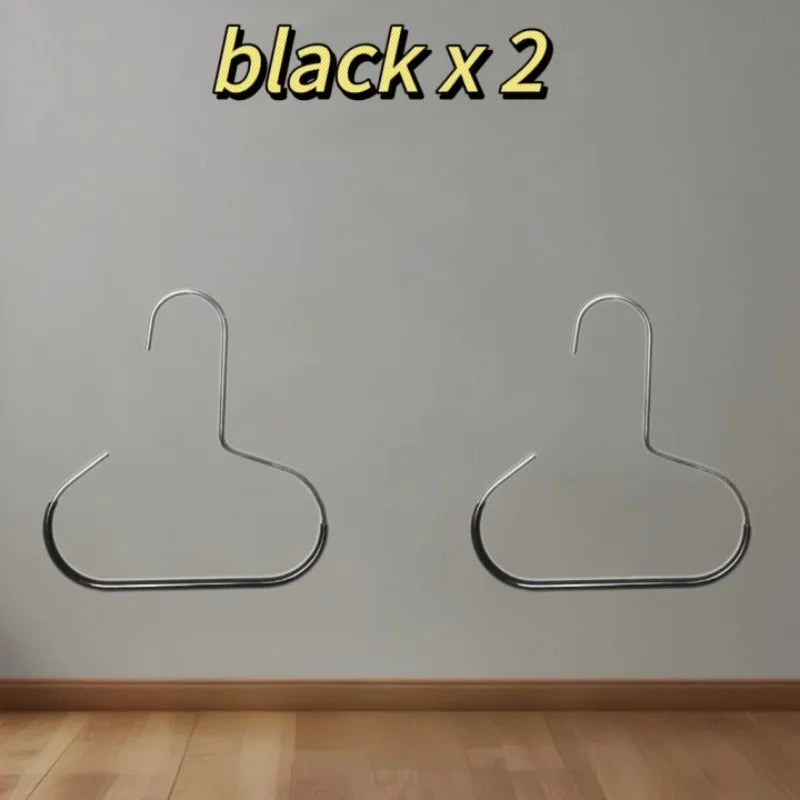 Two silver hat organizer racks mounted on a white wall.