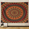 A large bohemian mandala tapestry wall hanging featuring intricate geometric patterns in shades of red, orange, and dark blue
