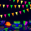 A collection of neon glow party banner flags and various glowing accessories displayed on a dark surface.
