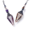 A natural crystal pendulum necklace set featuring purple and amber-colored stones suspended on silver chains.