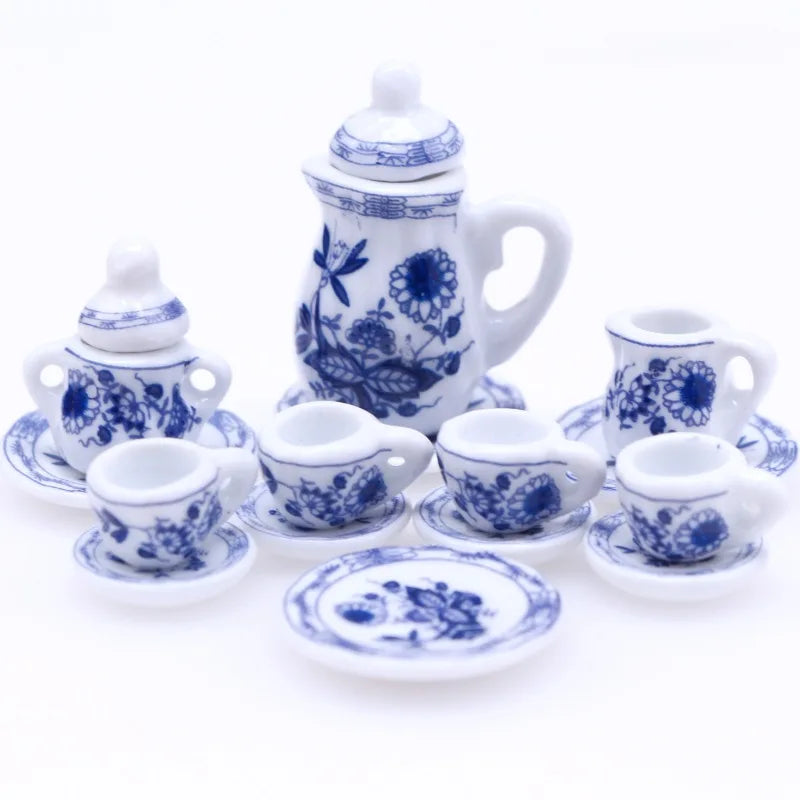 A 15-piece miniature porcelain tea set for a dollhouse featuring a teapot, cups, and saucers in blue and white.