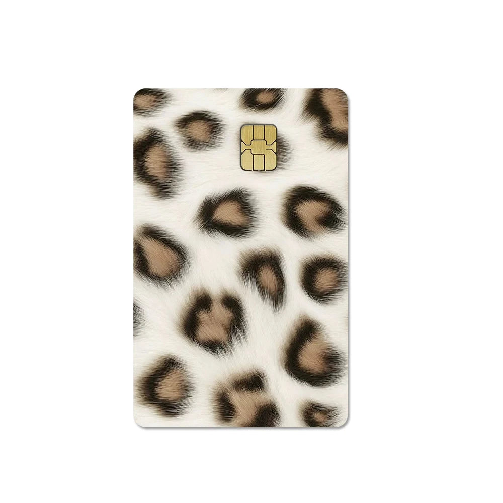 A rectangular card cover featuring a leopard print design with a gold-colored card slot.