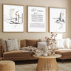 A set of three framed Islamic Arabic calligraphy wall art prints displayed above a beige sofa.