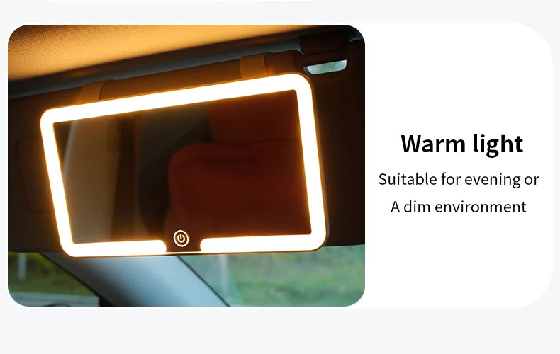 A car sun visor vanity mirror with a warm light LED illumination shown inside a vehicle.