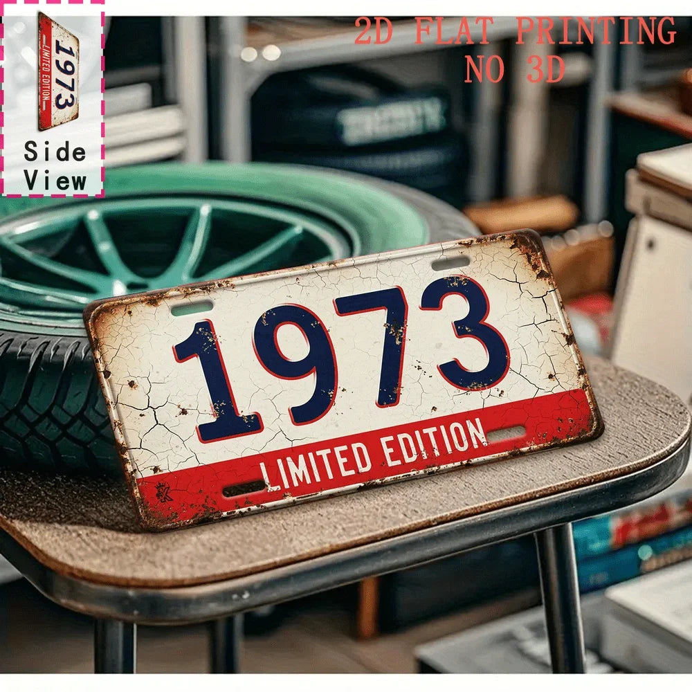 A distressed metal tin sign with the year 1973 and limited edition text displayed on a wooden surface.