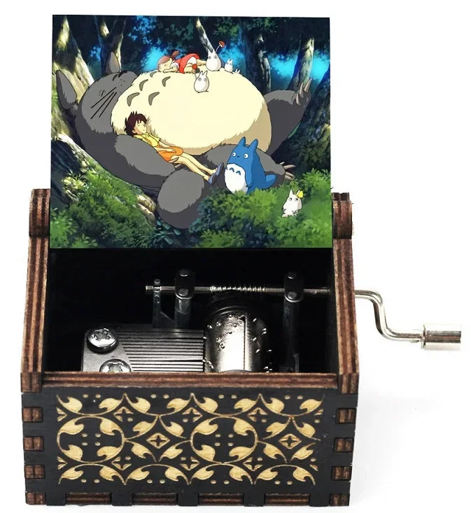 Hand-cranked wooden music box featuring a Totoro design with characters in a forest setting.