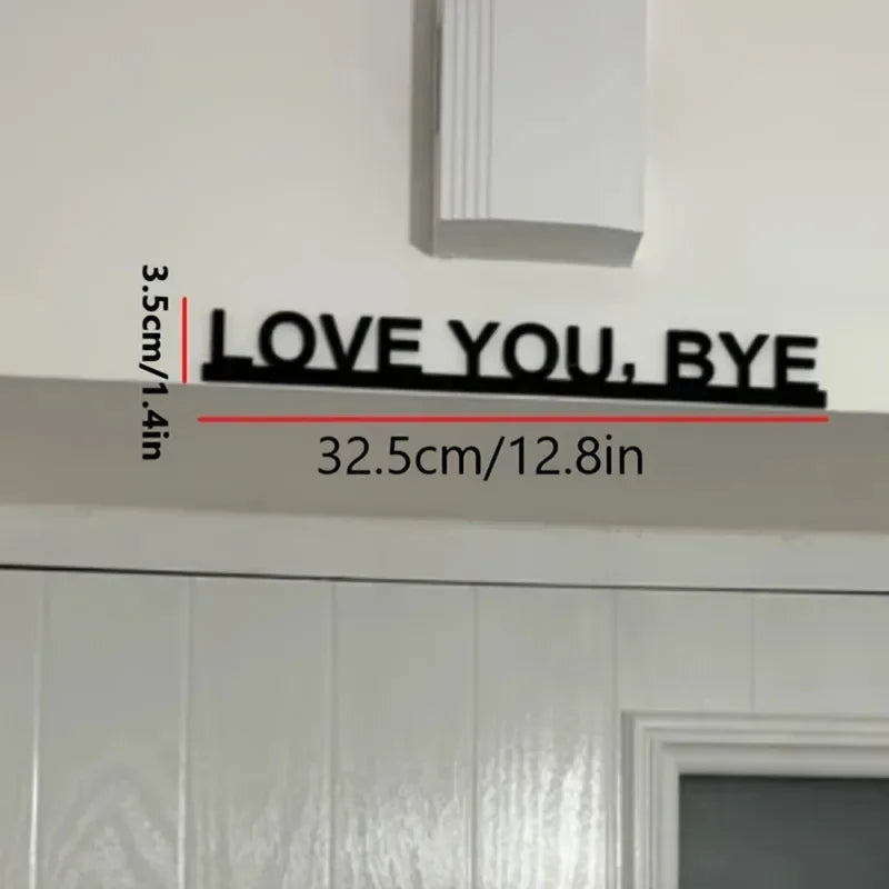Black metal wall art sculpture with the text LOVE YOU BYE measuring 3.5cm or 1.4in wide