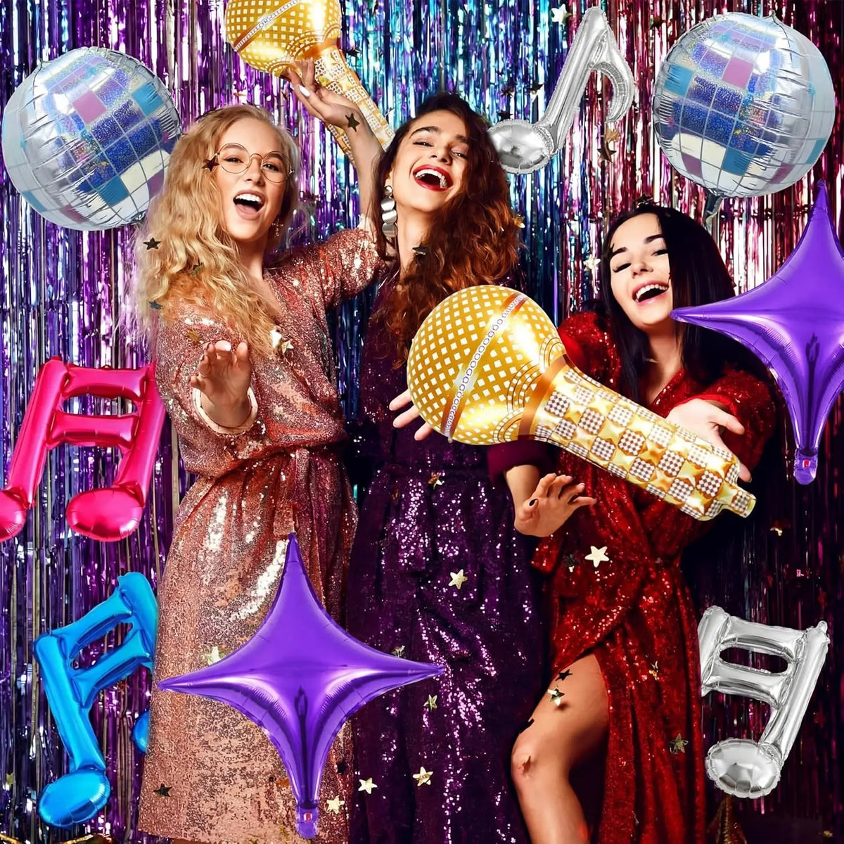 A group of women celebrating with gold and purple music note foil balloons.