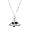 Silver pendant necklace featuring a diamond-inlaid Saturn design.