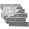 A collection of rectangular gray peel and stick vinyl wall tiles arranged in a staggered, stacked pattern.