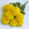 A bouquet of bright yellow artificial hydrangea and camellia flowers with green leaves.