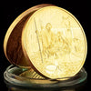A gold-plated commemorative coin depicting a scene from the Last Supper with Jesus and disciples.