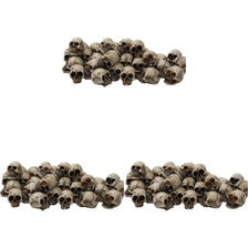 A set of realistic skull figurines used for Halloween and gothic decor.