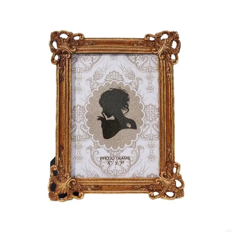 An elegant gold resin photo frame with a vintage European design featuring a silhouette of a person.