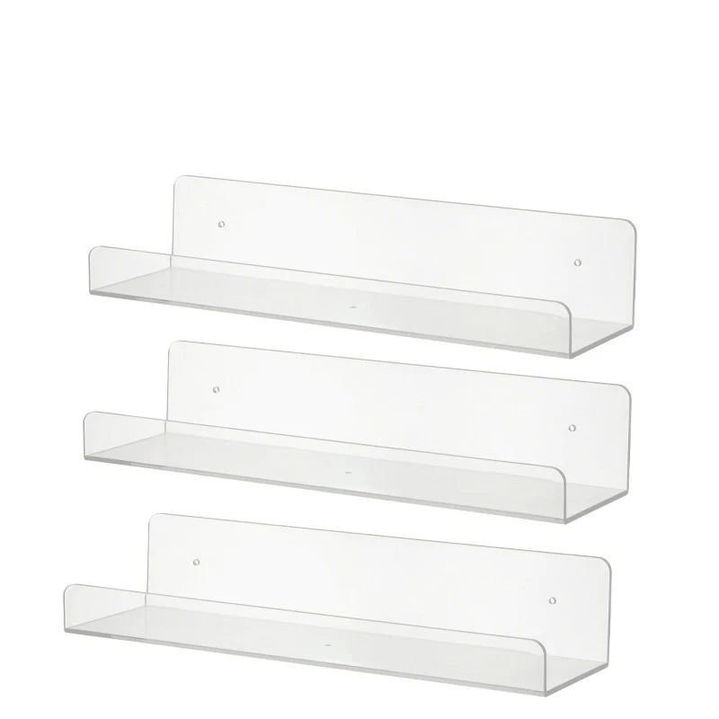 Three clear acrylic floating display shelves mounted on a wall.