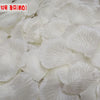 White silk rose petals used for weddings and events