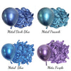 Four metallic latex balloons in dark blue, peacock blue, blue, and purple colors shown next to crumpled foil.