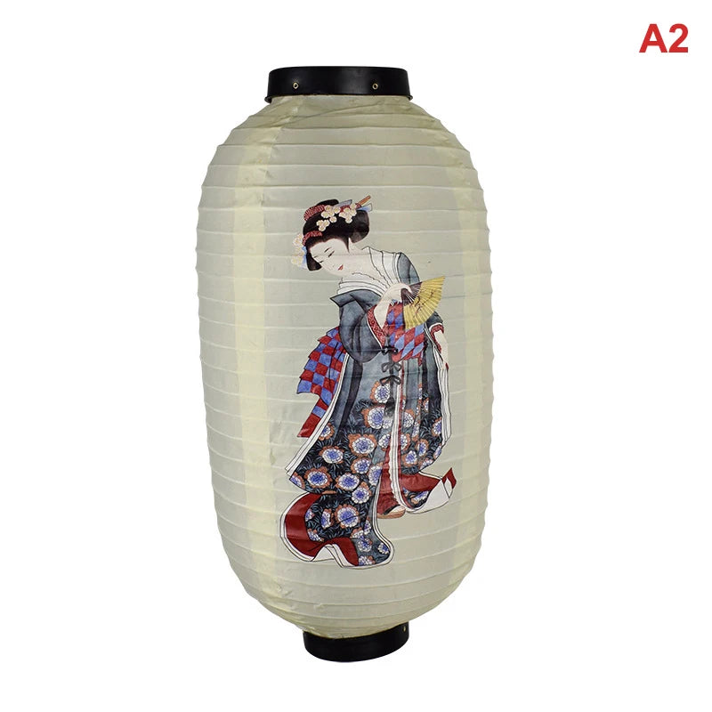 A light beige paper hanging lantern with a dark top, featuring a traditional Japanese woman painted on the front.