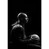A man in a dark shirt is shown in profile against a black background, likely for basketball art.
