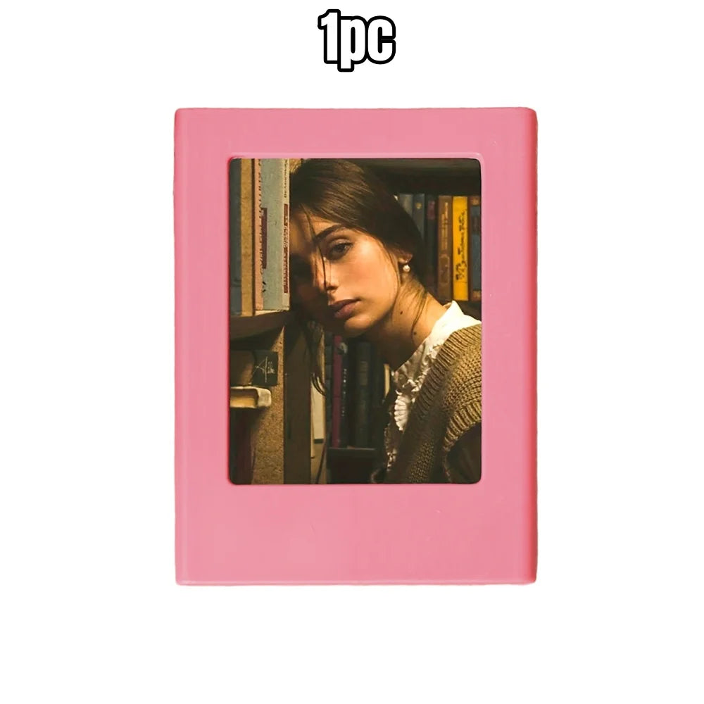 A pink retro magnetic photo frame displaying a portrait of a woman surrounded by books.