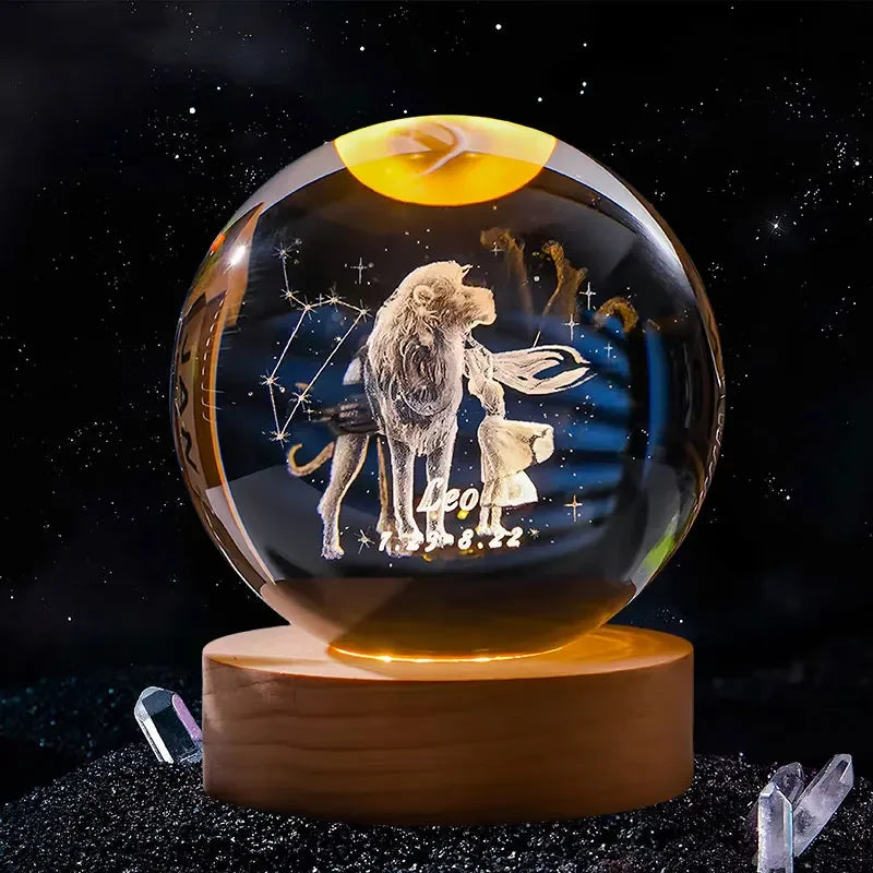 A spherical crystal ball with a gold glow features a laser engraved image of a lion and a lamb against a dark background.