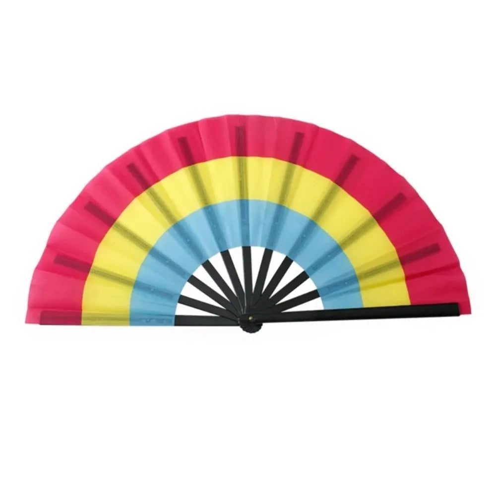 A colorful folding hand fan with pink, yellow, and blue segments.