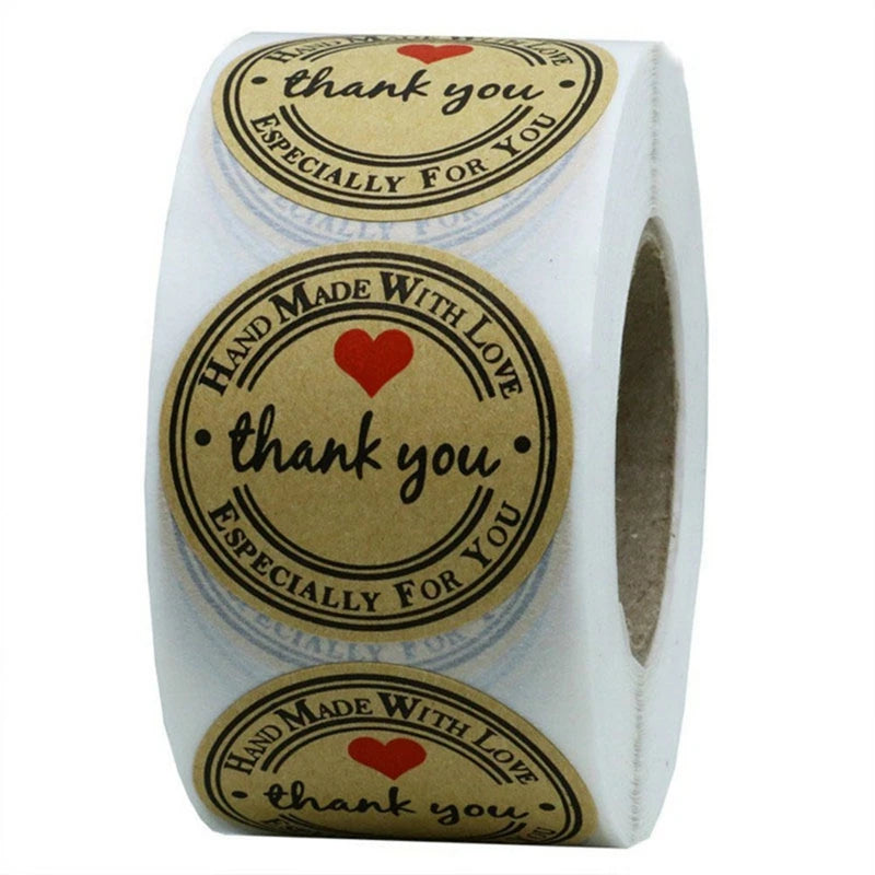 Roll of kraft paper thank you stickers with text inside round labels