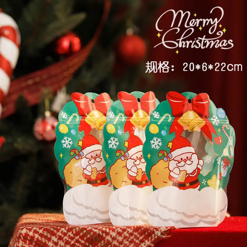 Three reusable green Christmas gift bags featuring Santa Claus designs and festive patterns