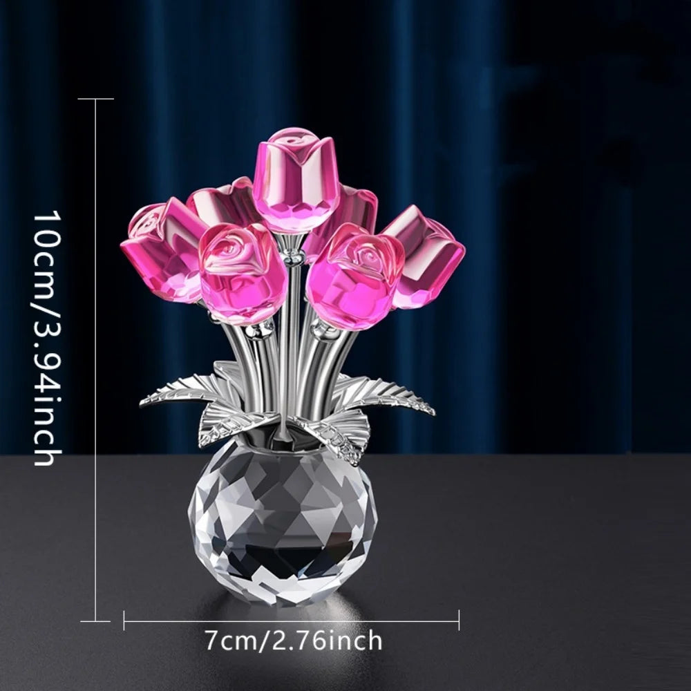 A bouquet of pink crystal roses displayed in a clear glass vase on a dark surface.