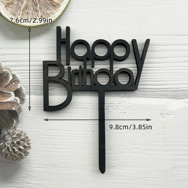 Black wooden birthday cake topper spelling out Happy Birthday