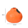 An orange ceramic fruit-shaped vase with a black opening and dimensions 8cm high and 9.5cm wide.