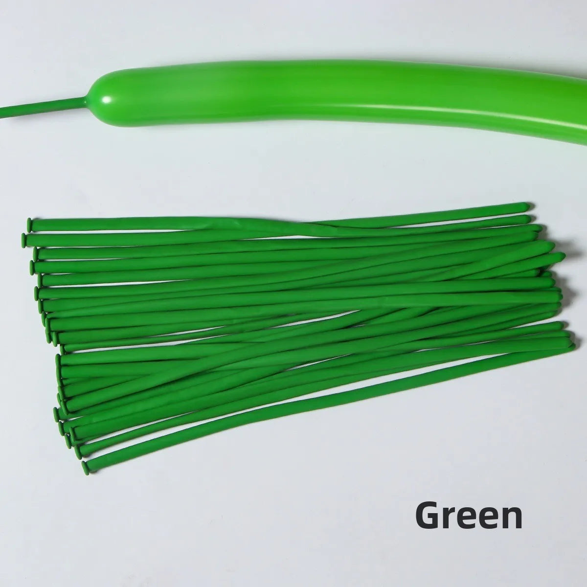 A green latex strip balloon is shown next to a bundle of green balloons.
