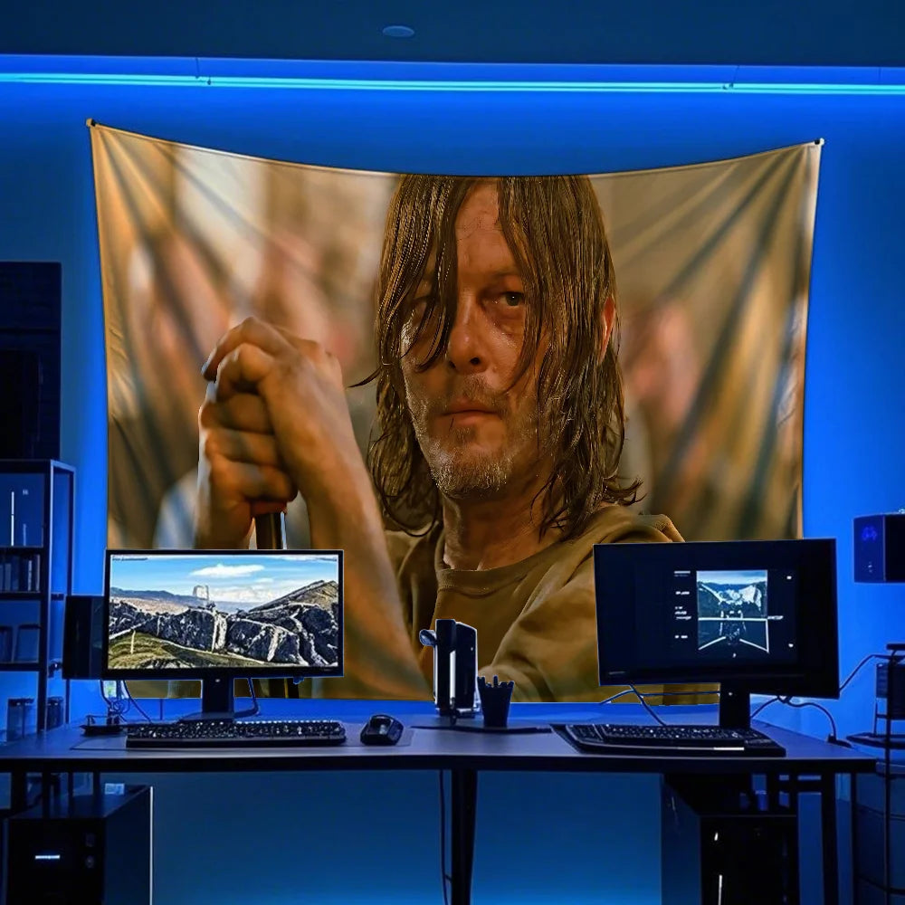 A man with long hair is featured in a banner display against a blue background, surrounded by computer monitors.