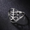 Silver signet ring featuring a stylized Leviathan cross design on a dark surface.