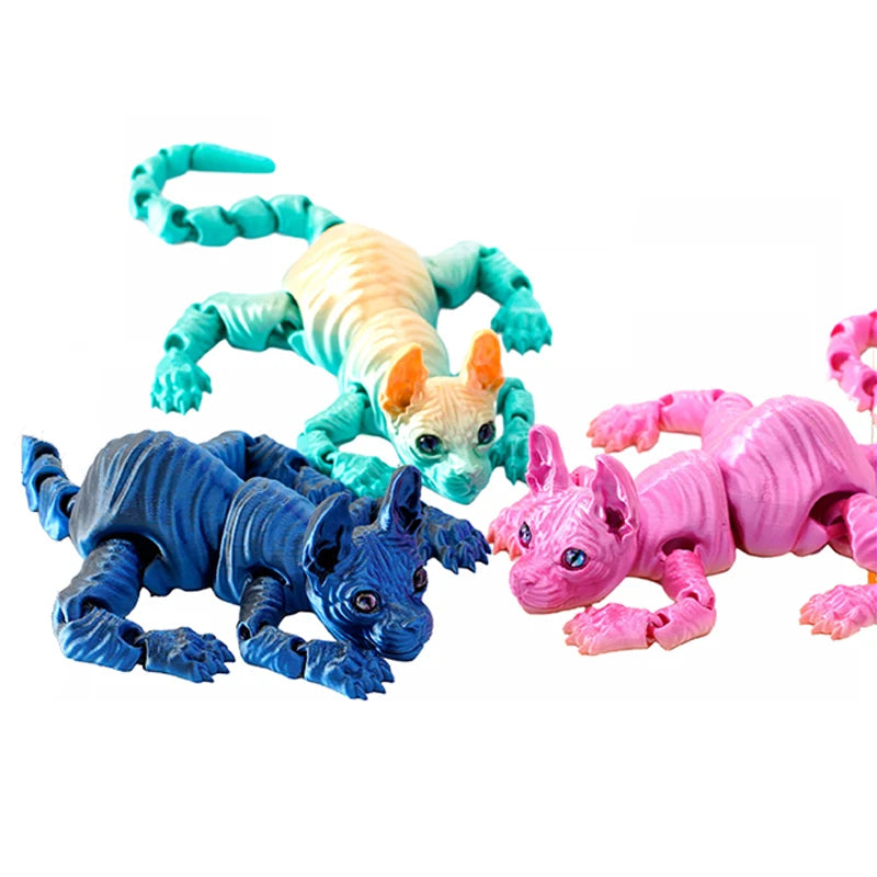 A set of three realistic 3D printed figurines of Sphynx cats in blue, yellow, and pink.