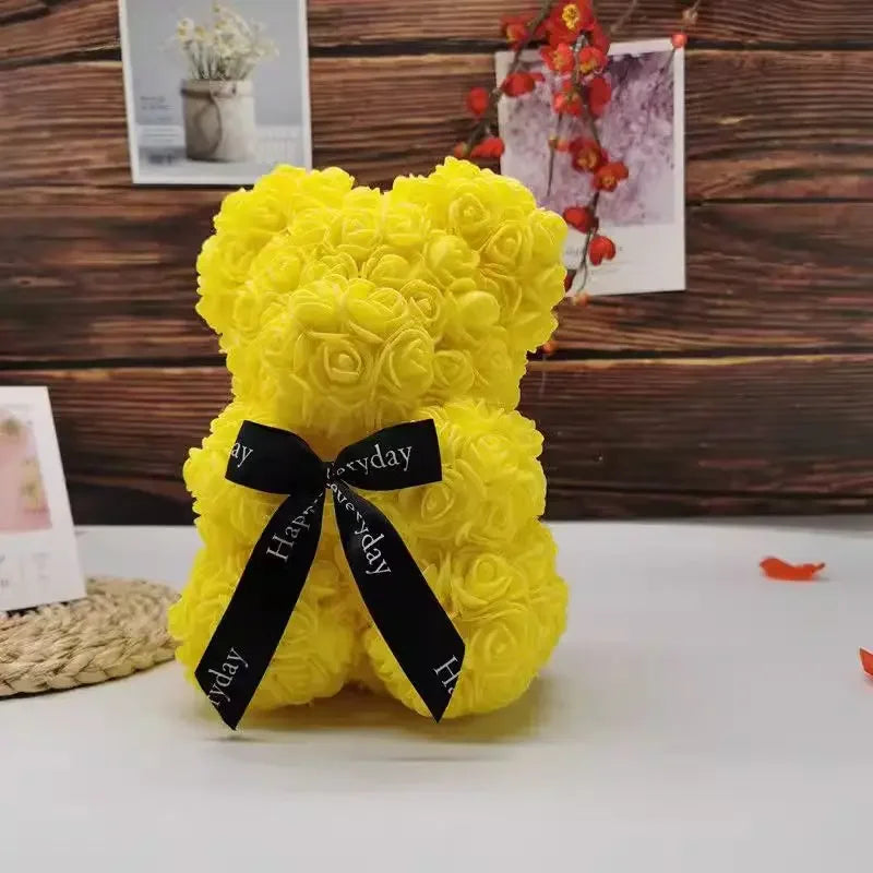 Helles gelbes künstliches Rosen-Teddybär mit schwarzer Schleife für romantische Dekoration.
