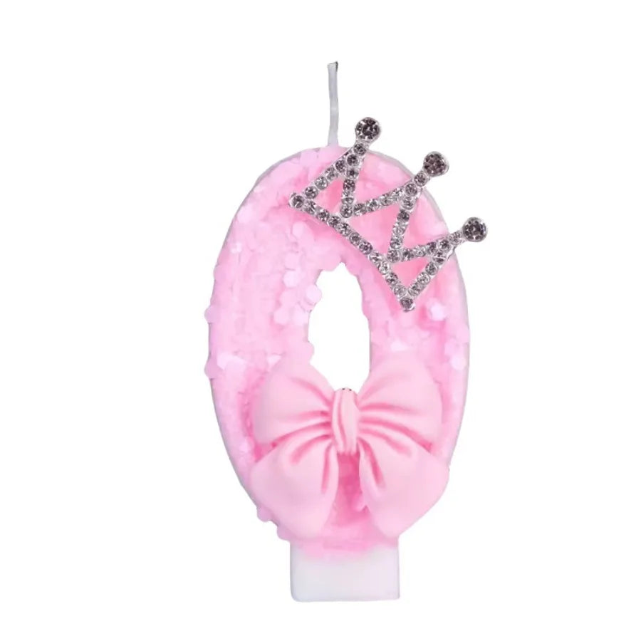 Pink glittery crown shaped candle for a princess birthday cake topper