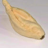 A light tan plush monkey toy with a soft, fuzzy texture.