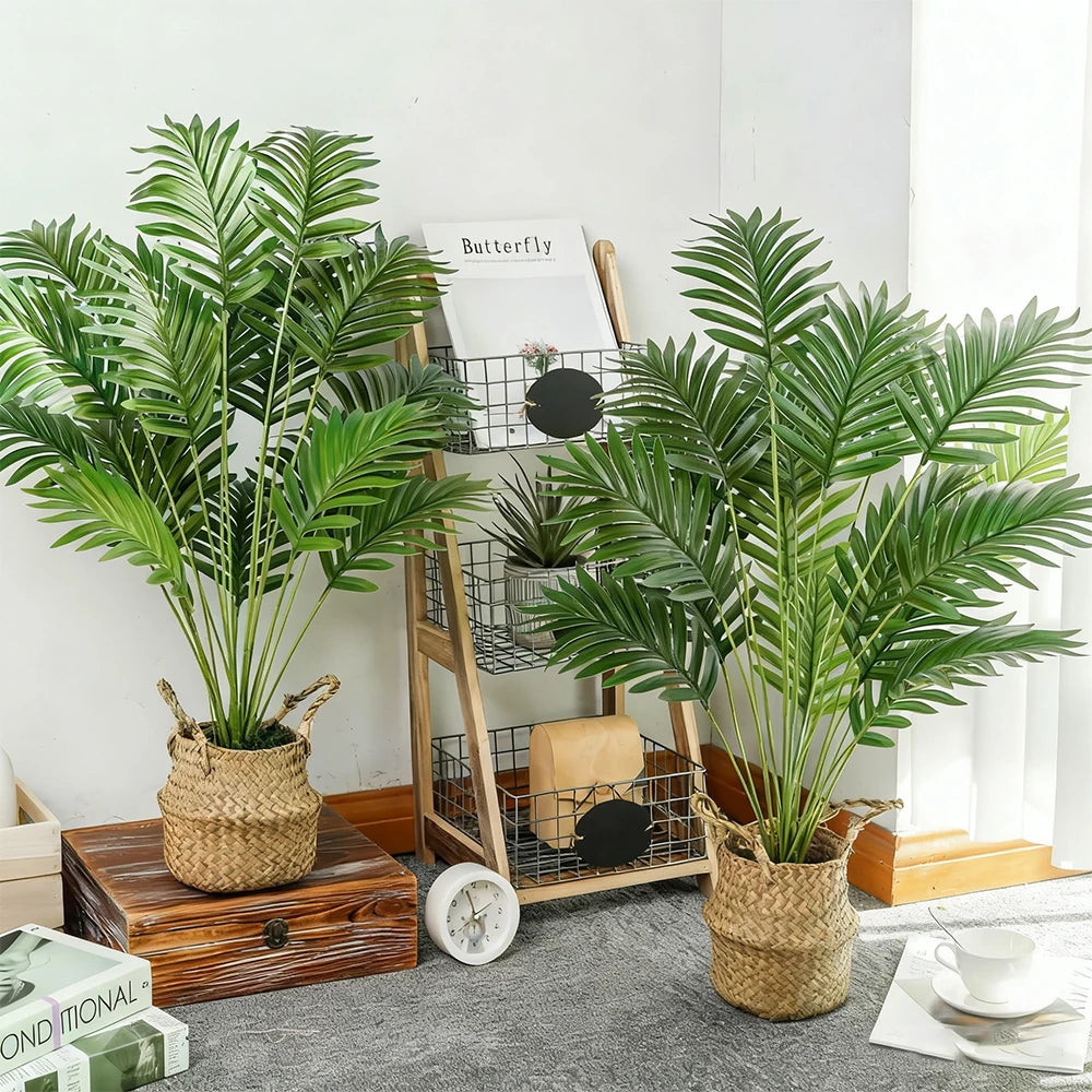 Artificial areca palm tree in a woven pot displayed on a wooden surface.