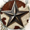A vintage western cowboy star metal sign featuring a five-pointed star design with distressed leather and fur textures.
