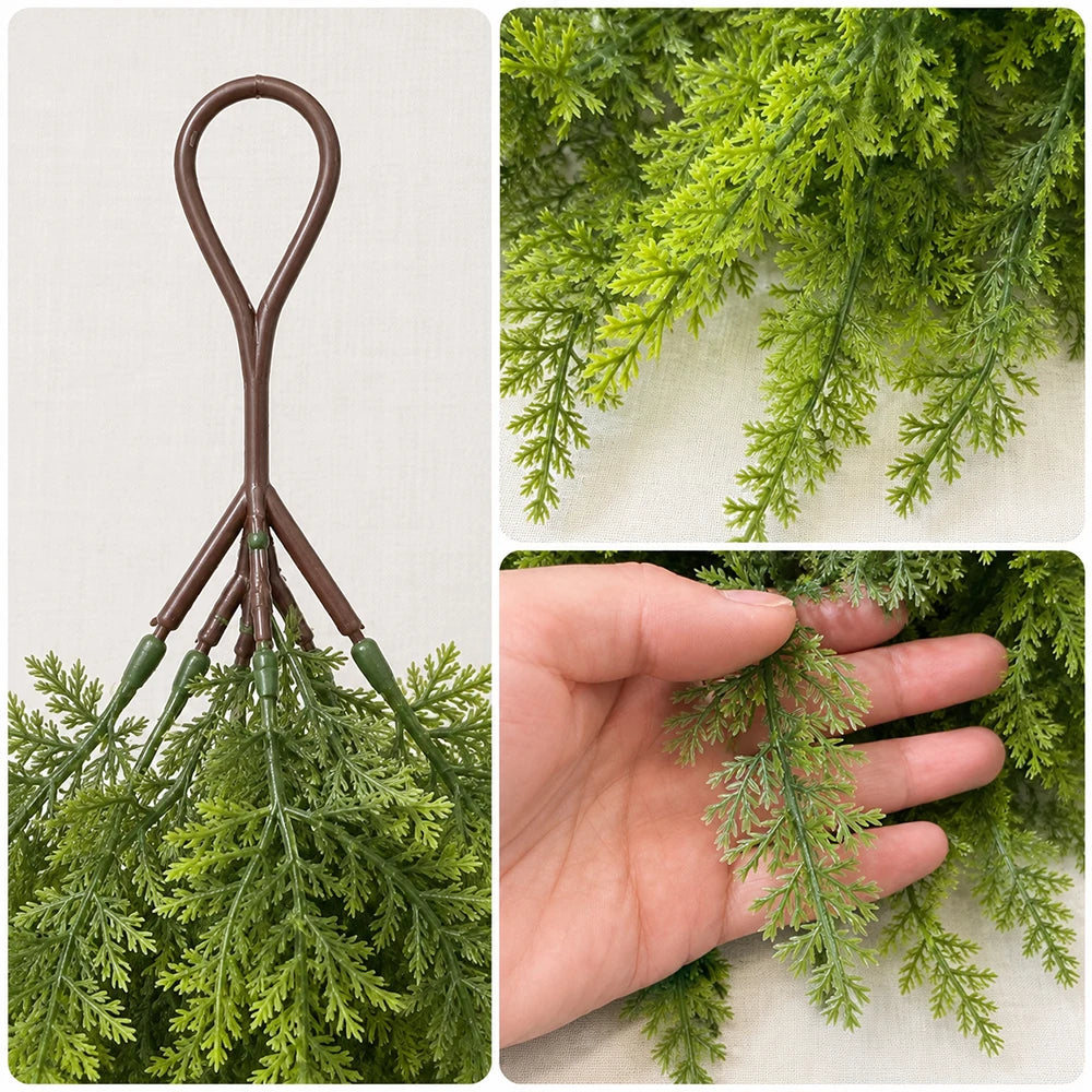 Artificial Christmas teardrop swag made of green Norfolk pine needles with a brown hanger.