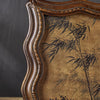 A vintage resin photo frame with a distressed gold-brown finish and dark botanical pattern.